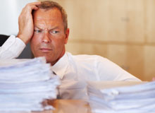 A picture of an overwhelmed business man - Kathbern Management - Toronto Recruiting Agency