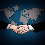 Handshake Over a Map of the World - Kathbern Management Toronto Executive Headhunters