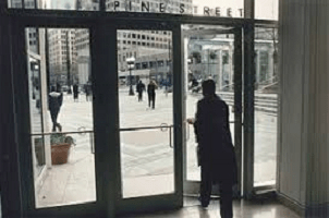 An Employee Leaving an Office Building - Kathbern Management Toronto Recruitment Agency