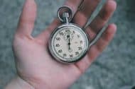 A hand holding a stop watch - Kathbern Management Toronto Recruiting Agency