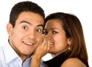 A Woman Whispering Something in a Man's Ear - Kathbern Management Toronto Recruiting Agency