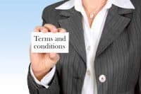 A Person Holding a Terms and Conditions Card - Kathbern Management Toronto recruiting agency