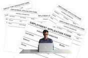 Someone Filling Out An Employment Application Form - Kathbern Management Toronto Recruiting Firm