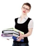 An Employee Carrying a Stack of Files - Kathbern Management Toronto Recruiting Firm