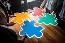 5 Business People Holding Puzzle Pieces - Kathbern Management Toronto Hiring Company