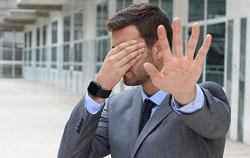 A Businessman Covering His Face - Kathbern Management Toronto Executive Headhunters