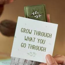 A Person Holding A Card Saying Growth Through What You Go Through - Kathbern Management Toronto Recruiting Agency