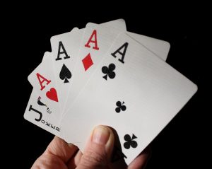 A 5 Card Poker Hand With Four Aces And a Joker - Kathbern Management Toronto Recruiting Agency