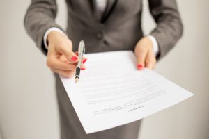 A Business Person Holding An Offer Letter - Kathbern Management Toronto Executive Headhunters
