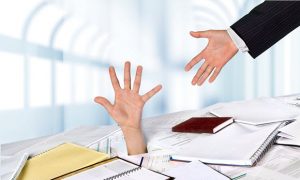 An Employee Hand Another A Stack of Files - Kathbern Management Toronto Recruiting Agency